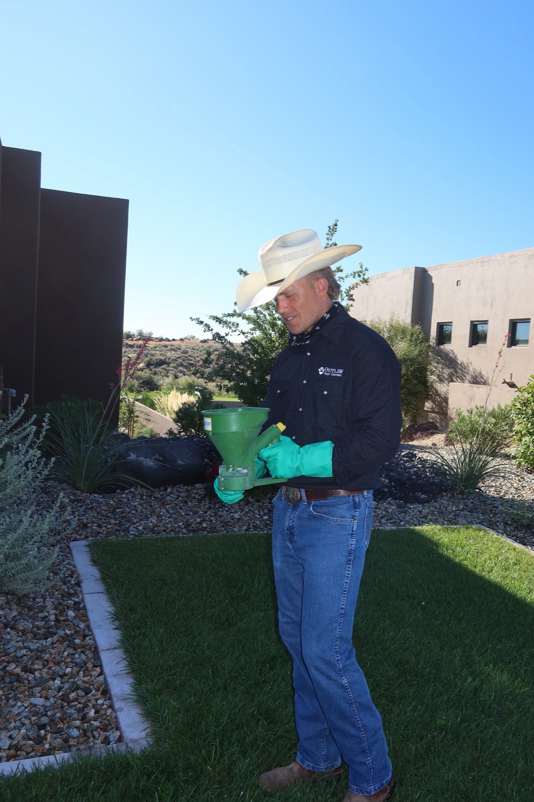 Applying granular treatment to a desert yard