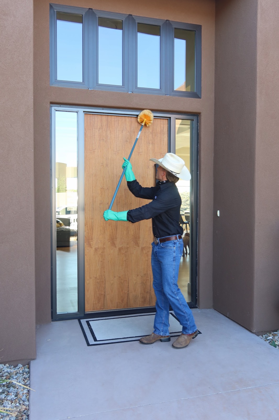 Technician clearing webs from a St. George home